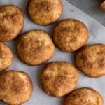 Image of pumpkin cookies on parchment paper. 